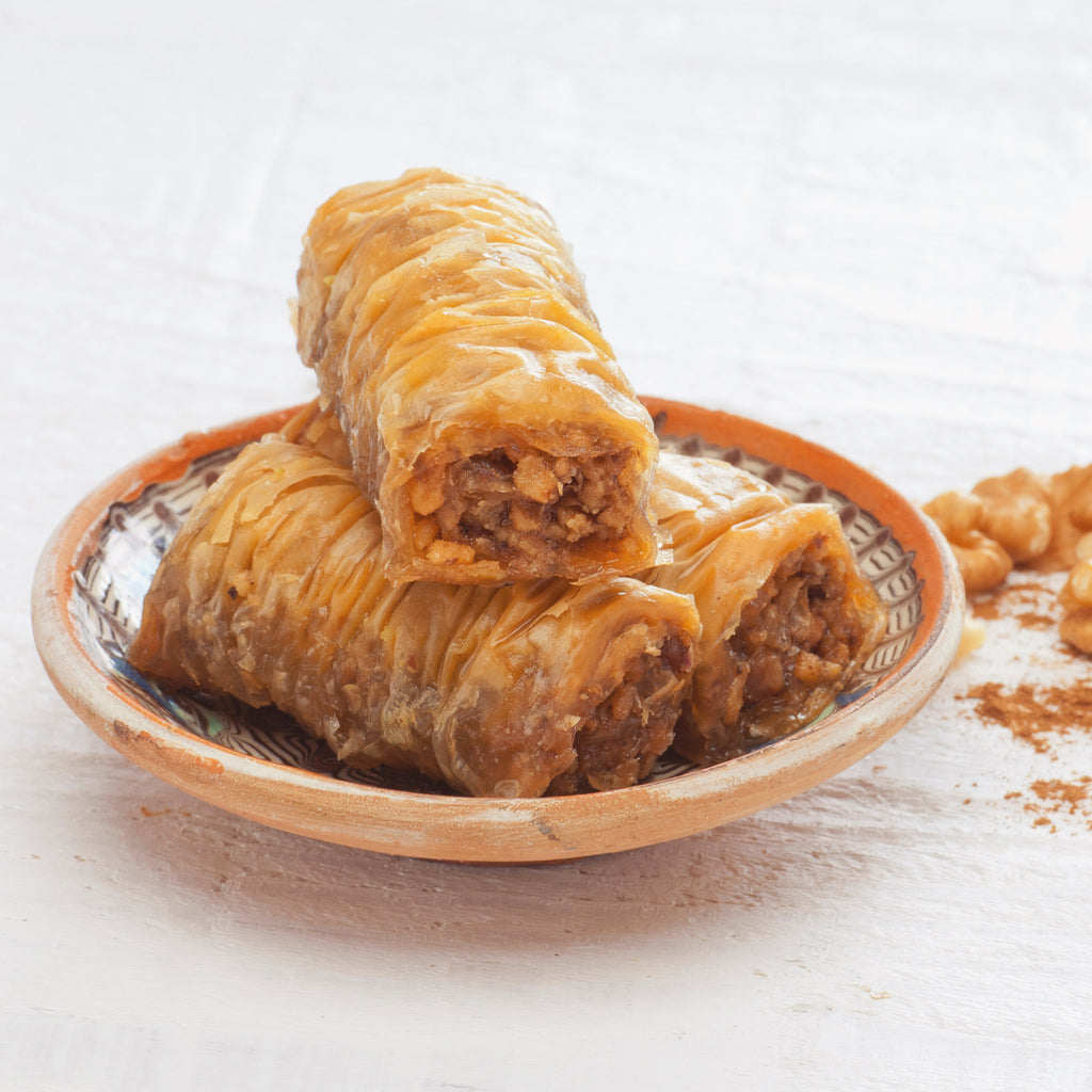 Zymi baklava rolls arranged in a gift box, ready to share